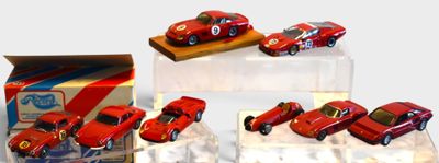 four red toy cars on display in a display case