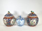 three vases sitting next to each other on a table