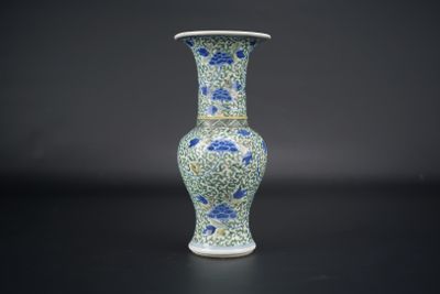 a blue and white vase with blue flowers on it