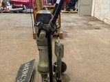 a small machine that is sitting in a warehouse