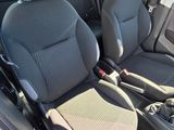 two seats in the back of a car that are black