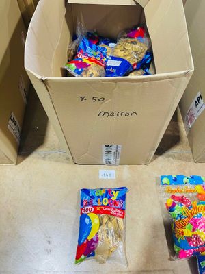 a box full of candy and a bag of candy on the floor