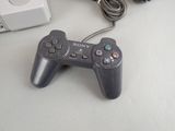 a video game controller sitting next to a video game console