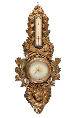 a clock hanging on the side of a wall