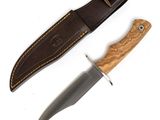knife and sheath on a white surface with a white background