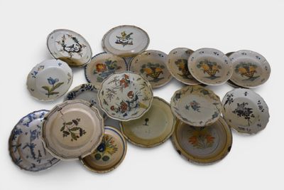 a lot of plates that are sitting on a table