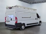 a white van that is parked in a room