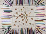 a white table cloth with a picture of donuts on it