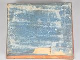 an old book with a blue cover sitting on top of a table