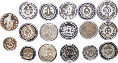 a close up of a bunch of coins on a white surface