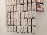 a lot of boxes of cigarettes sitting on the wall