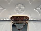 a white louis vu vu bag with a gold lock