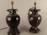 two lamps that are sitting next to each other on a table