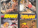 un lot de quatre bandes dessinées exposées sur une table