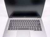 an open laptop computer sitting on top of a white table