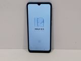 the back of a phone with a logo on it sitting on a table