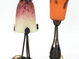 two lamps that are sitting next to each other on a table