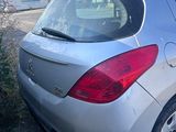 a silver car that is parked on the side of the road