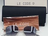 the sunglasses are next to a black case and a black bag