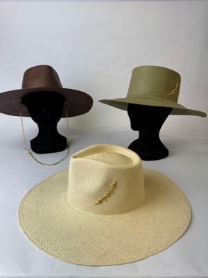 two hats on a mannequin head and a hat on a mannequin head
