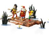 toy figurines of a group of people on a log in the water