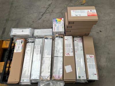 many boxes and packages on a pallet in a warehouse