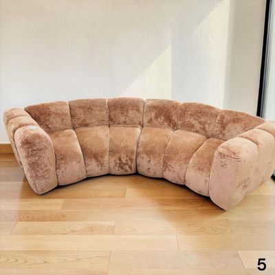 a couch that is sitting on a hard wood floor