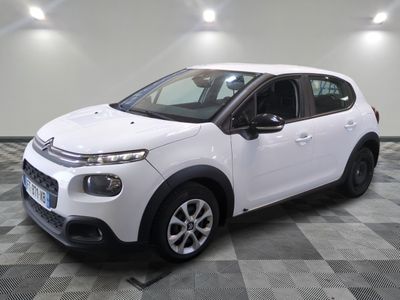 the white citrole is parked on a checkered floor