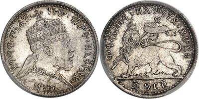 a silver coin with a picture of a woman on it