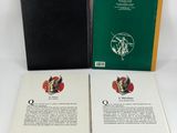 two books are sitting on a white surface next to each other