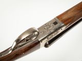 an old gun with a wooden handle on a white background