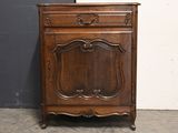 an old wooden cabinet with a mirror on top of it