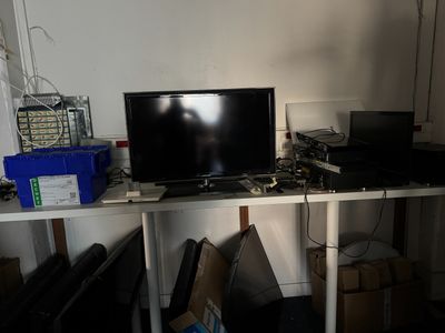 a desk with a monitor and a laptop on it