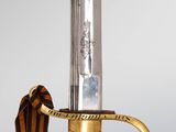 an image of a close up of a sword on a table