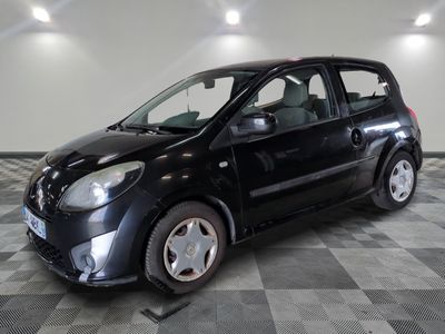 a picture of a small black car parked in a garage