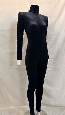 the mannequin is wearing a black bodysuit with a high neck and long sleeves