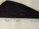 a drawing of a black shoe on a piece of paper