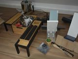 a coffee table with a tea pot and other items on it