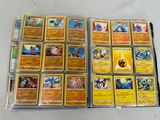 a lot of pokemon cards that are on the table