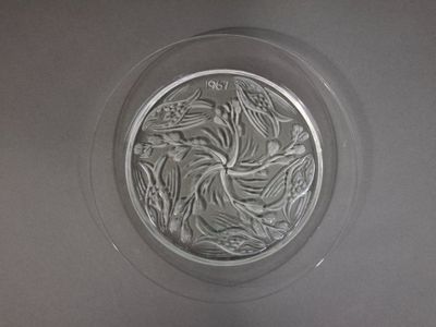 a glass plate with a design on it on a table