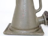 an old fashioned coffee pot sitting on top of a table