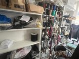 a room filled with lots of clutter and a chair