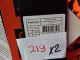a tag attached to the back of a black and orange tie