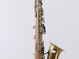 an old brass saxophone with a white background and a white background