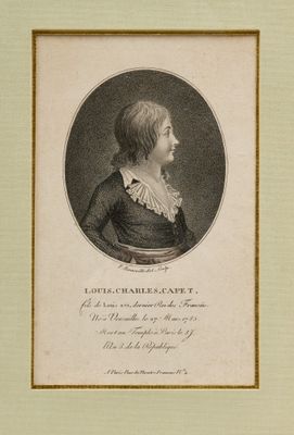 portrait of a young man in a black dress with a white collar