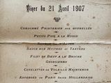 an old menu with a crown on top of it