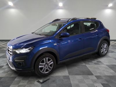 a blue toyota rav parked in a room with a checkered floor