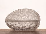 a glass bowl sitting on top of a wooden table