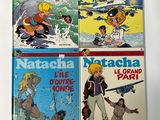 four children ' s books in a row on a white surface