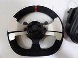 a steering wheel and a pair of headphones on a table